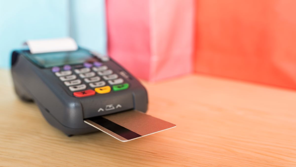 close-up-view-of-pos-terminal-with-credit-cards-AHSAZ3K